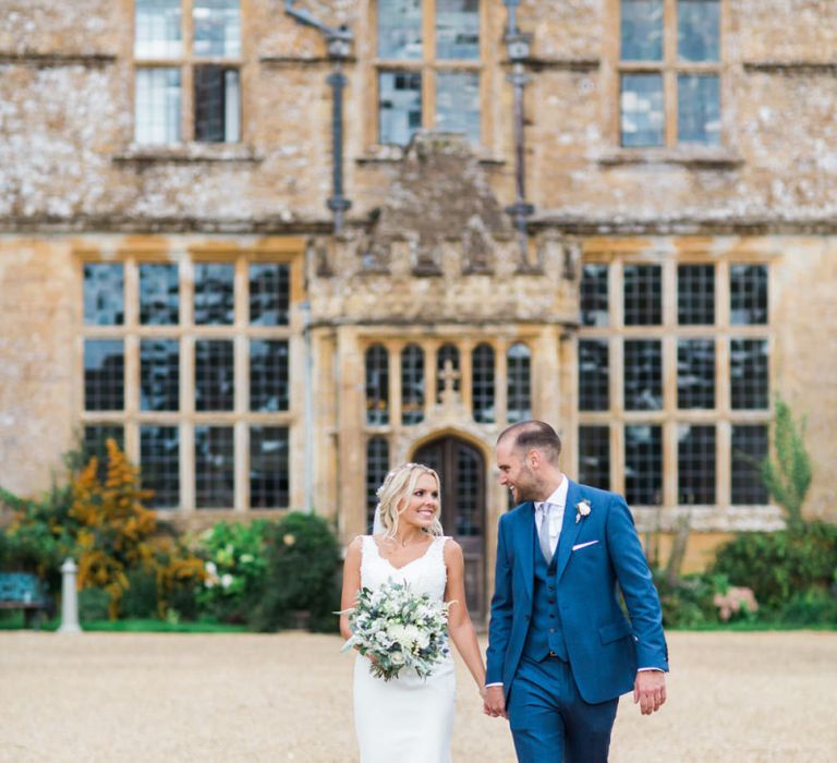 Bride in St Patrick La Sposa Wedding Dress and Groom in Blue Reiss Suit