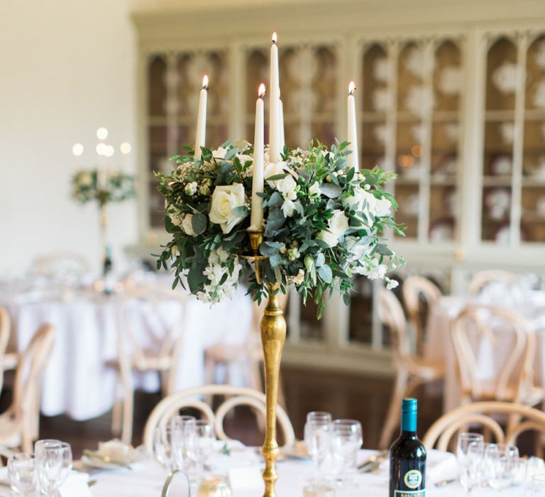 Gold Candelabra Tabel Centrepiece with White Flowers and Foliage