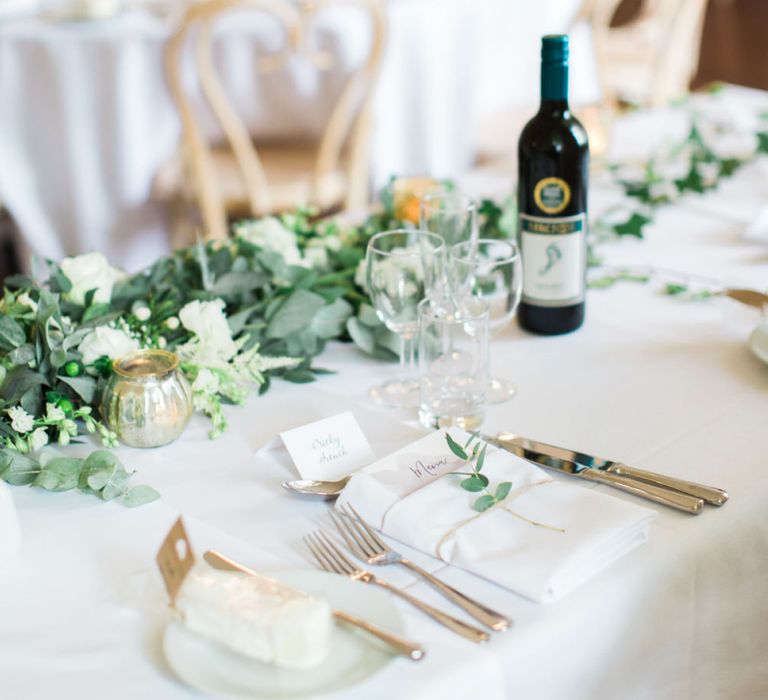 Elegant Place Setting and White Flower and Foliage Garland