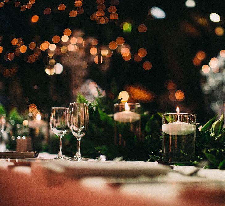 Floating Candles Decor | Botanical Black Tie Wedding at Rivington Hall Barn with Acrylic Candelabras &amp; Louis Ghost Chairs | Lawson Photography | Ever After Videos