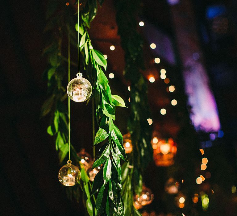 Hanging Votives | Botanical Black Tie Wedding at Rivington Hall Barn with Acrylic Candelabras &amp; Louis Ghost Chairs | Lawson Photography | Ever After Videos