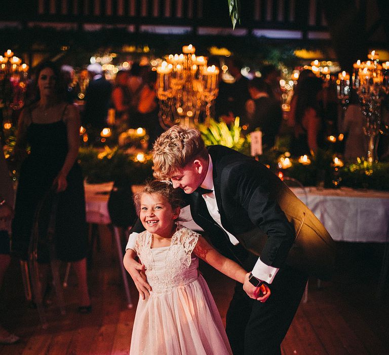 Wedding Guests | Botanical Black Tie Wedding at Rivington Hall Barn with Acrylic Candelabras &amp; Louis Ghost Chairs | Lawson Photography | Ever After Videos