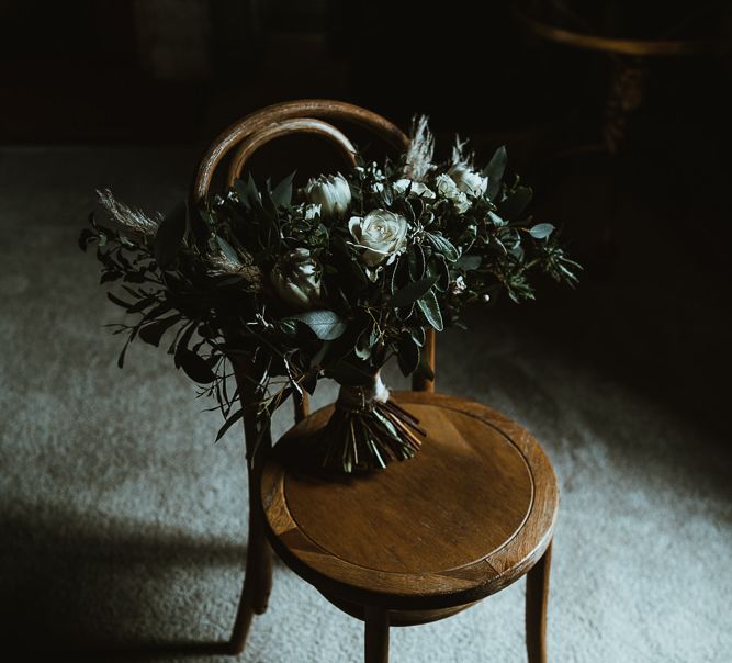 White floral and foliage bouquet for winter wedding with rustic styling