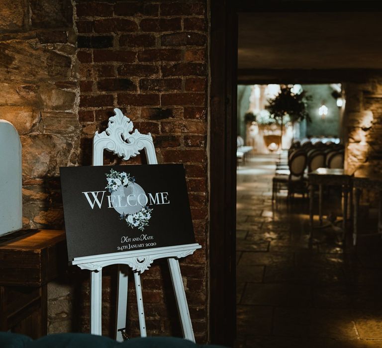 Black and white wedding sign at Le Petit Chateau with cosy winter styling