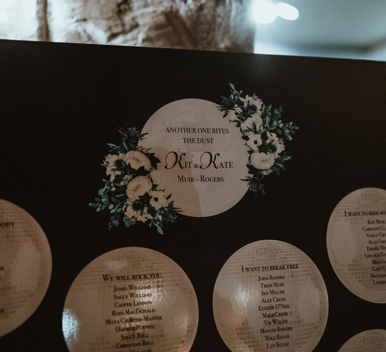 Glitter ball design table plan at winter wedding with white floral details