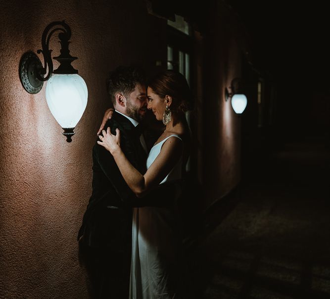 Bride and groom embrace at winter wedding