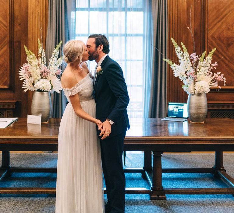 Bride and groom kissing at Old Marylebone Town Hall wedding