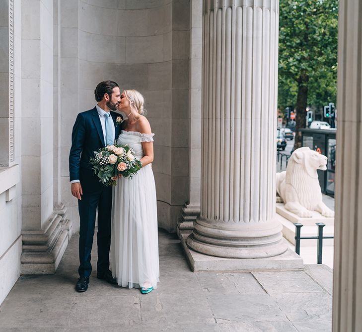 Bride and groom portrait outside Old Marylebone Town Hall by Miss Gen