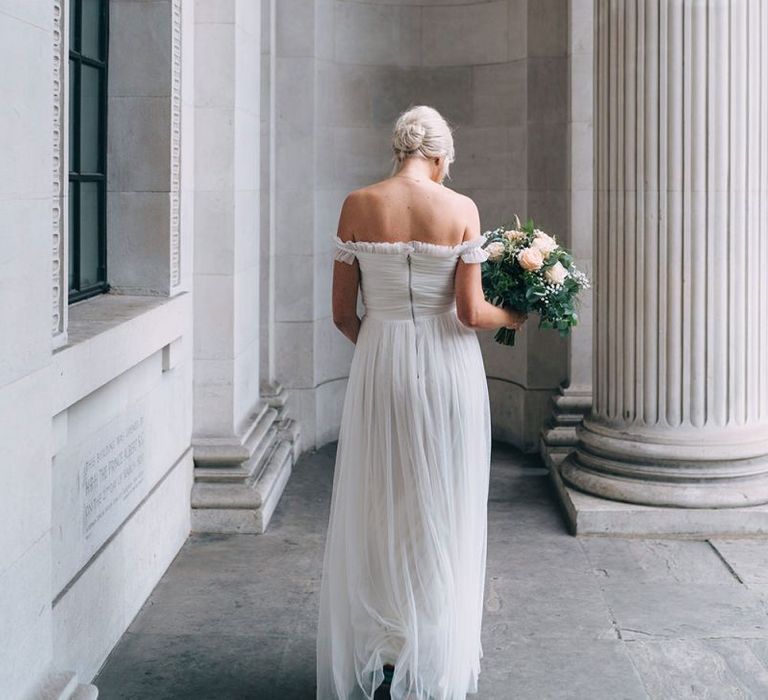 Bride in tulle off the shoulder wedding dress from the high street