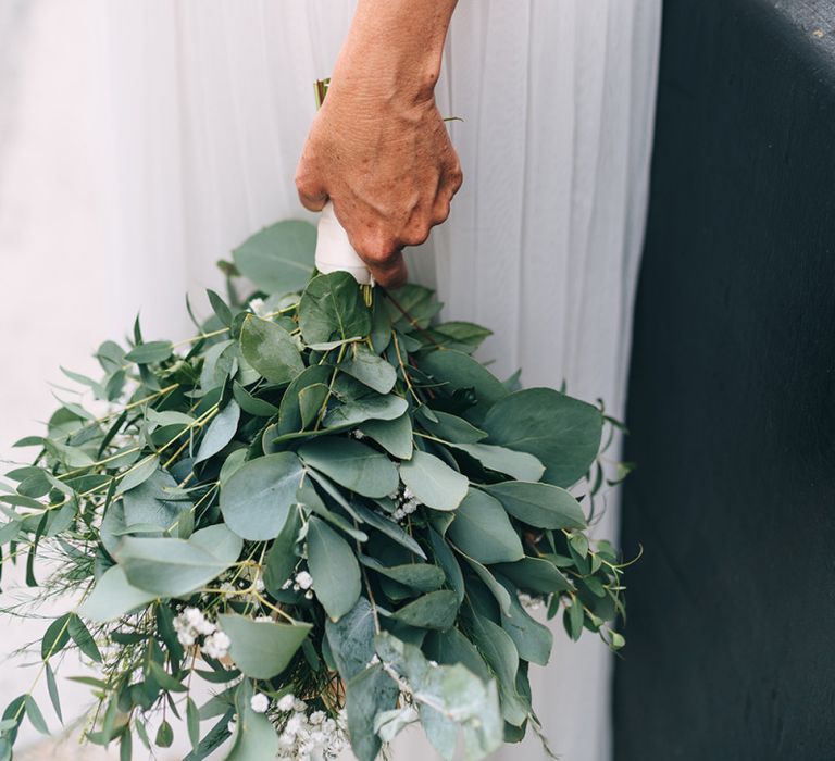 Hand tied wedding bouquet with eucalyptus