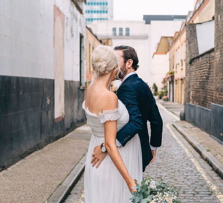 Bride and groom dancing in the streets in London