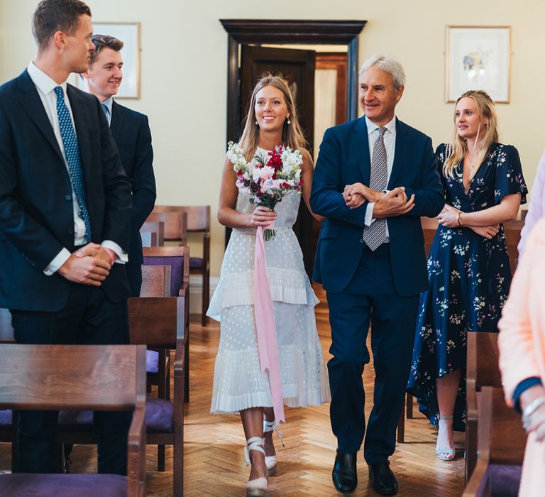 Bride Walks Down The Aisle During Ceremony