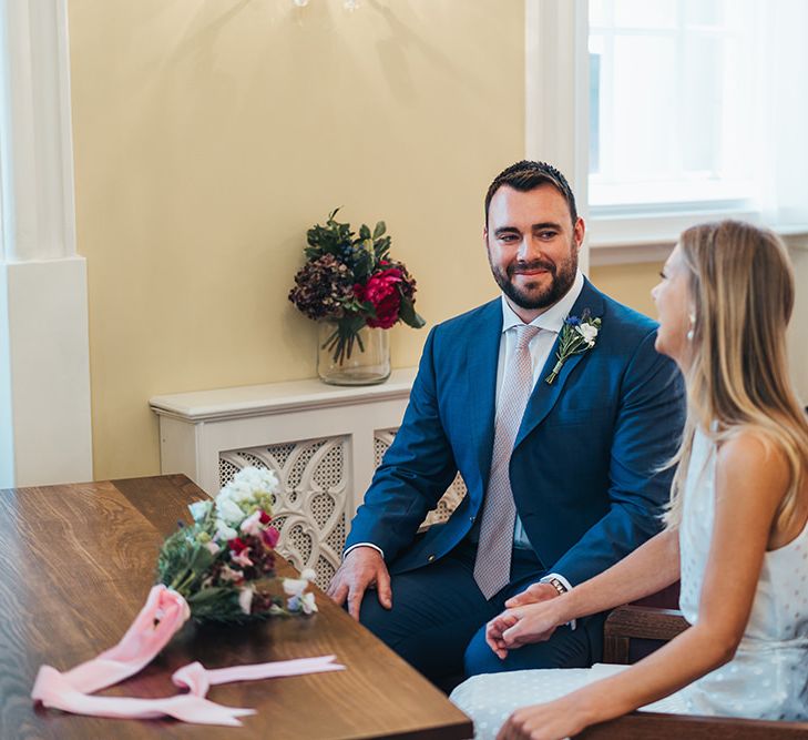 Bride and Groom Laugh During Ceremony