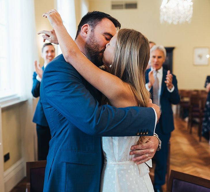 Bride and Groom Kiss After Exchanging Vows