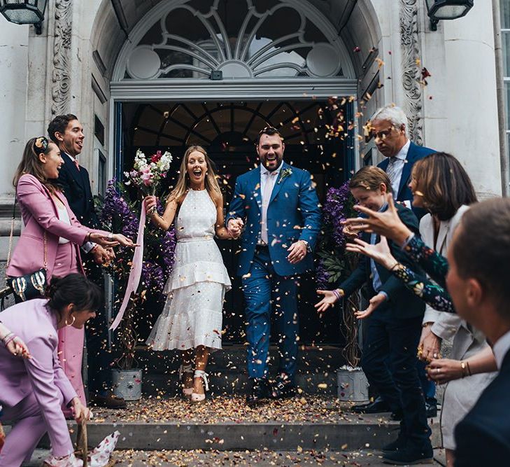 Bride and Groom Confetti Exit on Chelsea Town Hall Steps