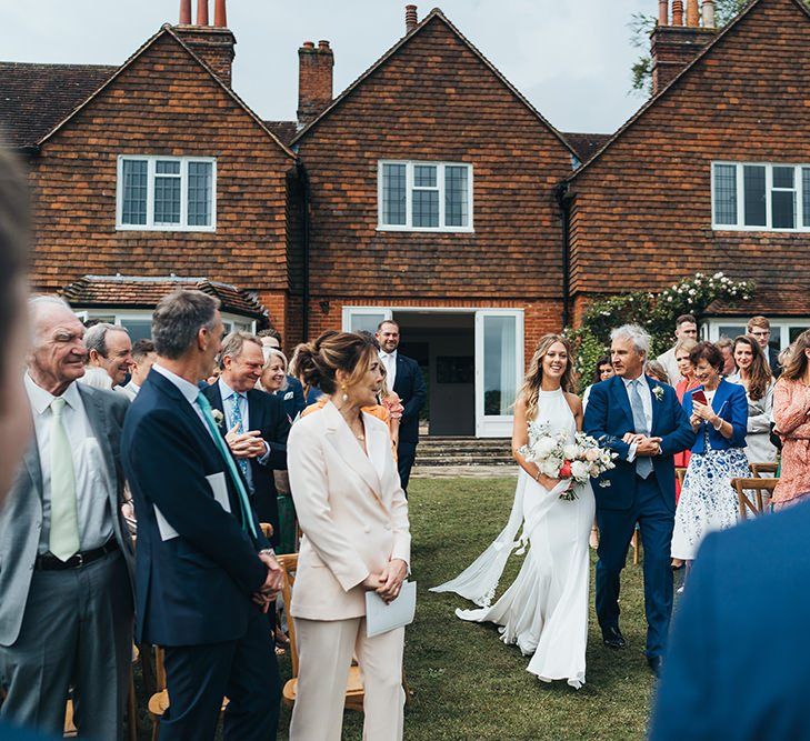 Outdoor Wedding Ceremony Bridal Entrance with Bride in Halterneck Made With Love Wedding Dress