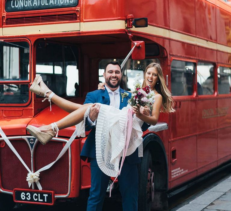 Groom Picks Up Bride