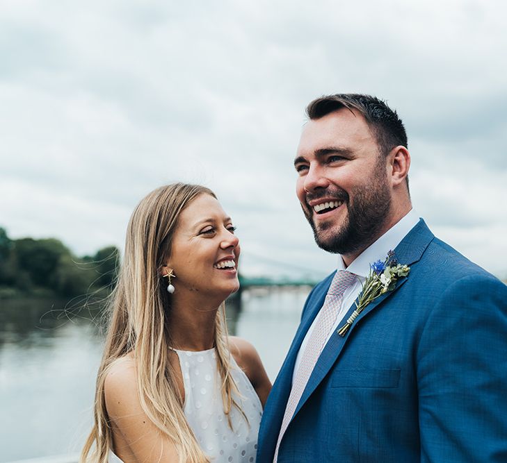 Bride and Groom Portrait In Front Of River