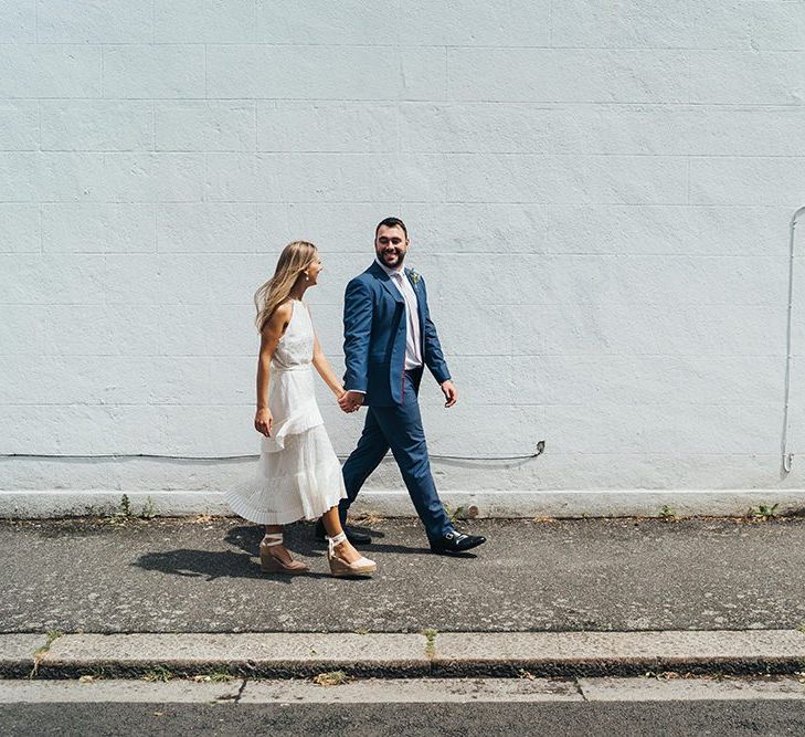 Bride and Groom Walking Down The Street