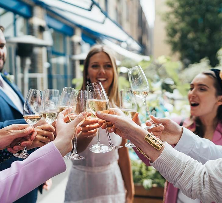 Bride and Groom Toast With Guests