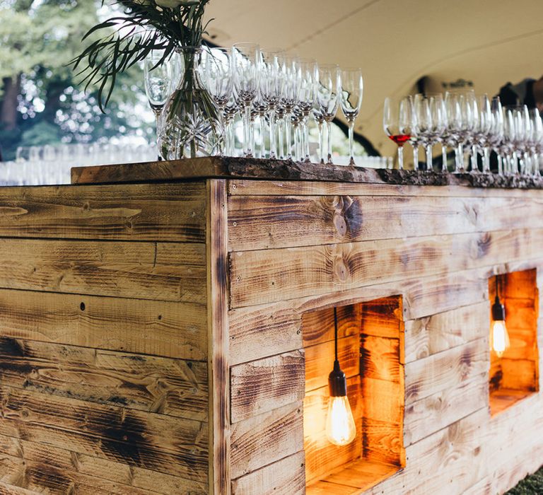 Wooden Bar with Edison Bulb Lights by Miss Gen