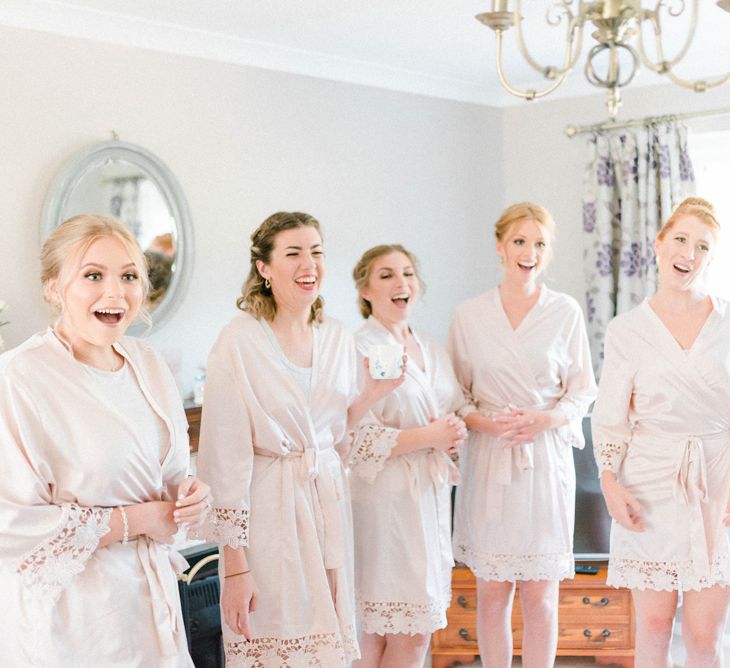 Bridesmaids on Wedding Morning in Matching Blush Pink Getting Ready Robes