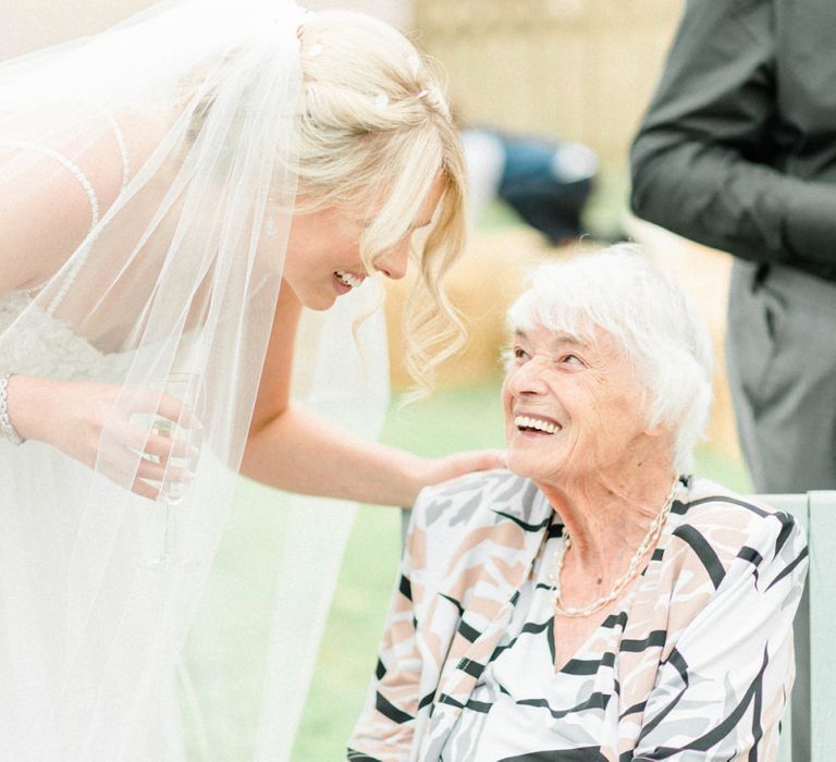 Bride and Name Talking at Drinks Reception