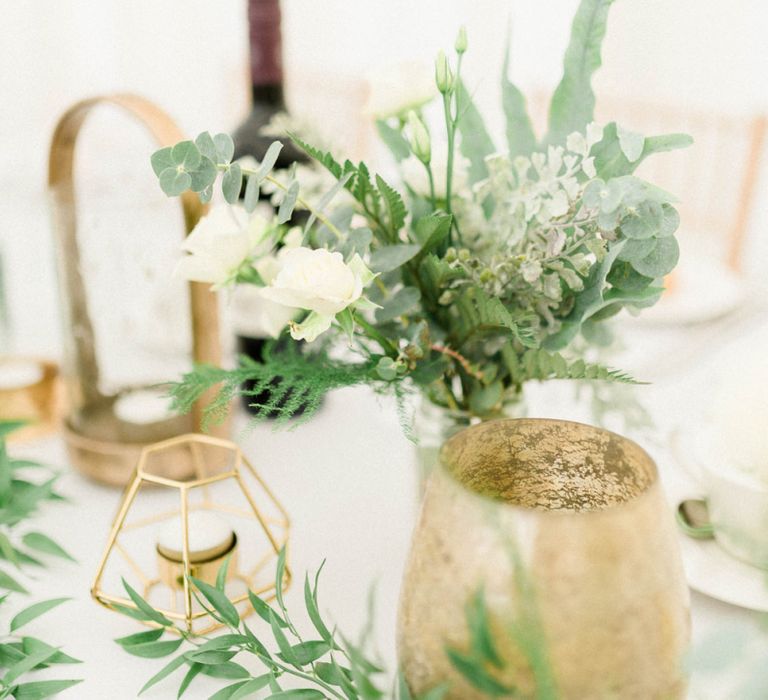 White and Green Wedding Flowers with Gold Vases and Geometric Candle Holders