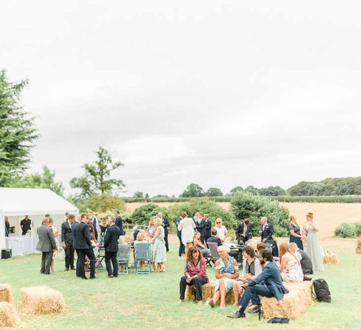 Outdoor Marquee Reception with Hay Bale Seating Area