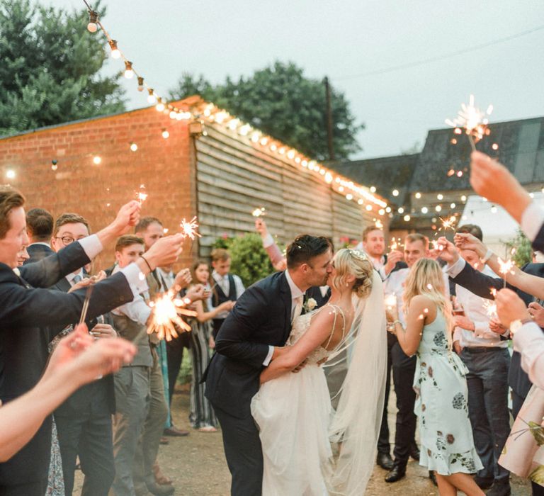 Bride and Groom Kissing at Sparkler Exit