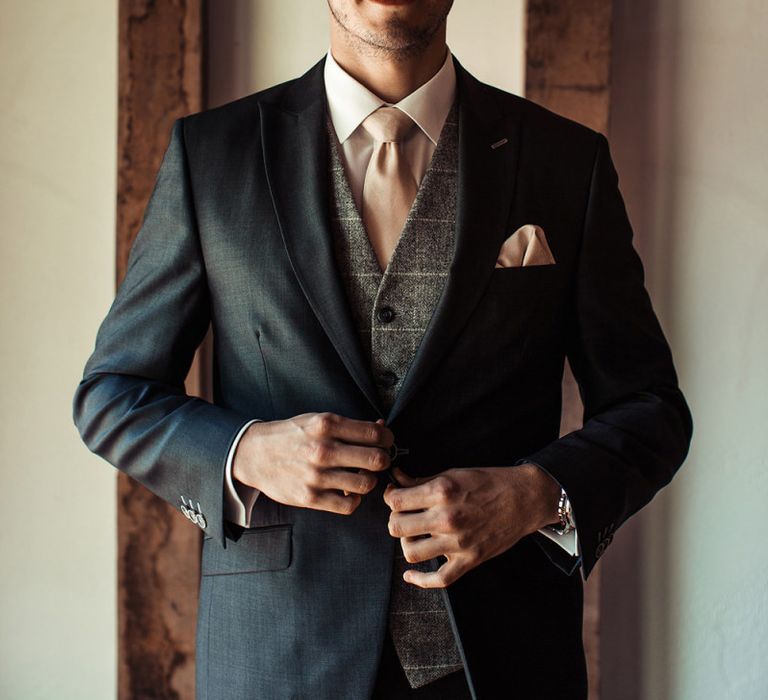 Groom In Tweet Waistcoat and Pink Tie