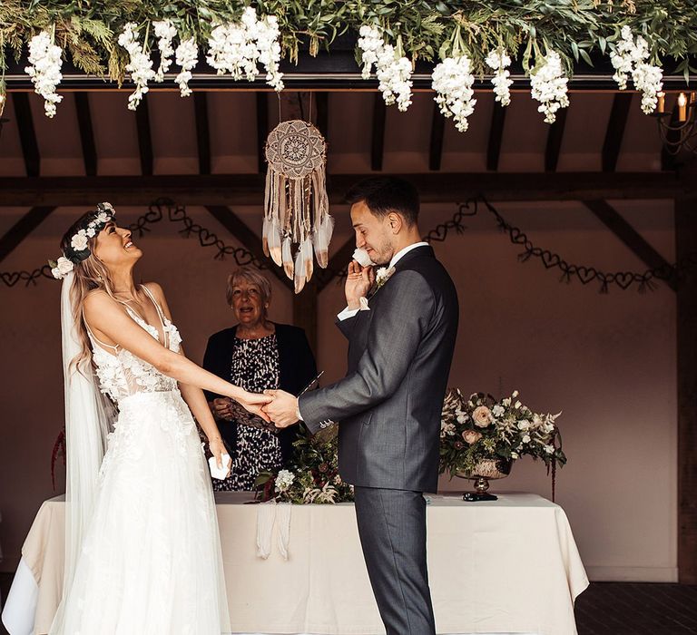 Bride Wears Flower Crown As Couple  Exchange Vows