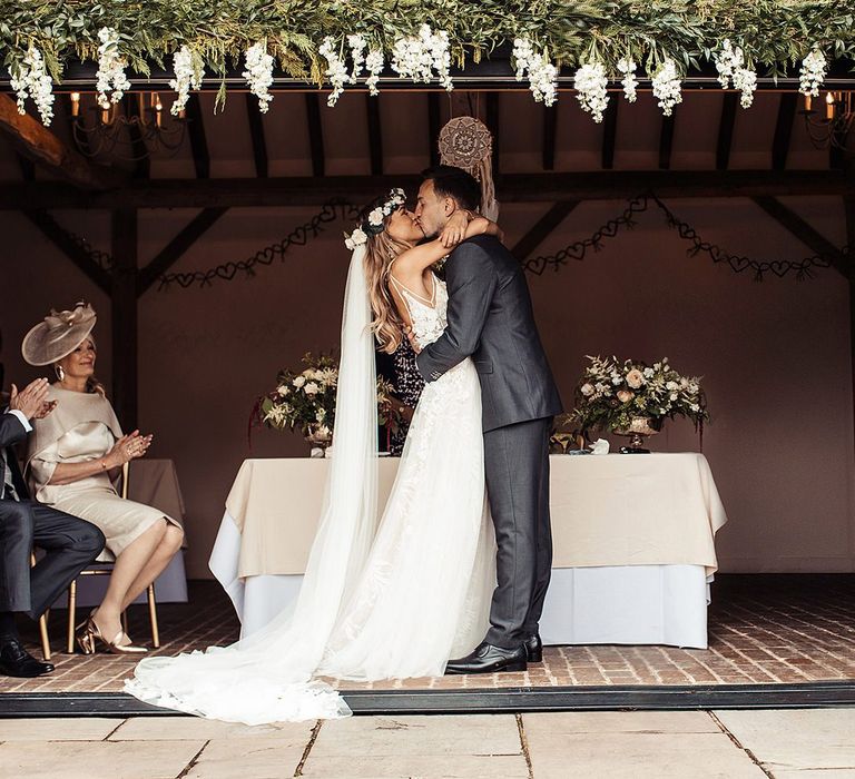 Bride and Groom Kiss As Husband And Wife