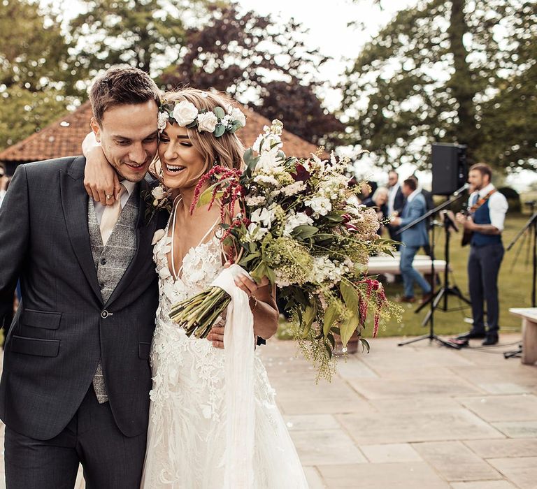 Bride Holds Wedding Bouquet Wearing Flower Crown