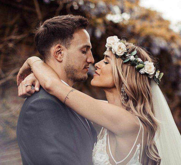 Bride and Groom Embrace During Barn Wedding