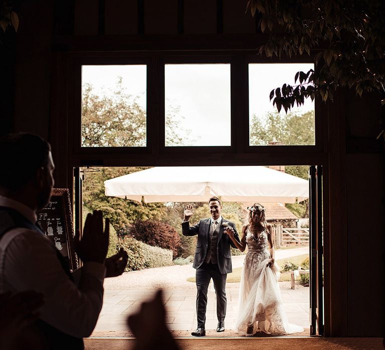 Bride and Groom Make Entrance to Barn Wedding Reception