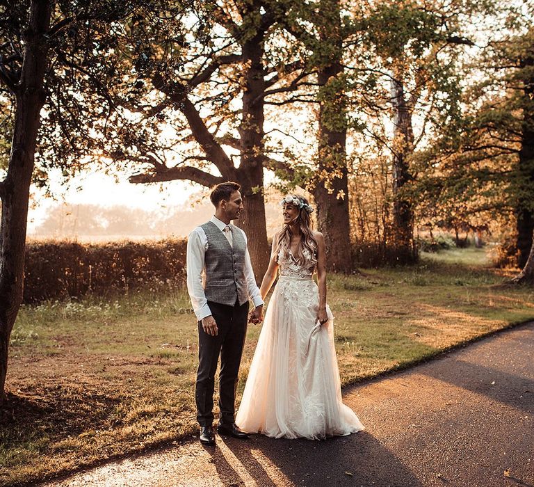 Bride and Groom Walk Through Essex Wedding Venue Grounds