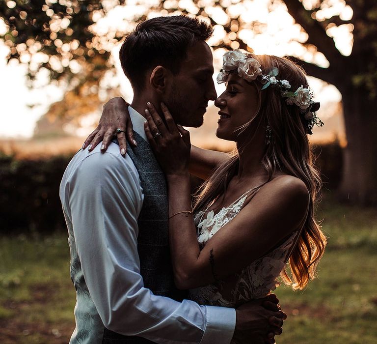 Bride and Groom Embrace During Barn Wedding