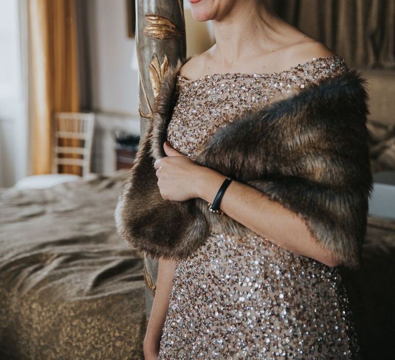 Bridesmaid In Gold Sequin Dress with Faux Fur Wrap Around