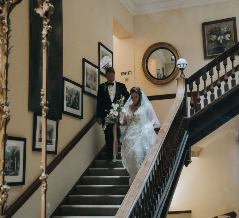 Bride Comes Down The Staircase With Father at Oxfordshire Wedding Venue