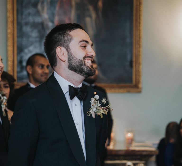 Grooms Smiles As Bride Walking Down The Aisle