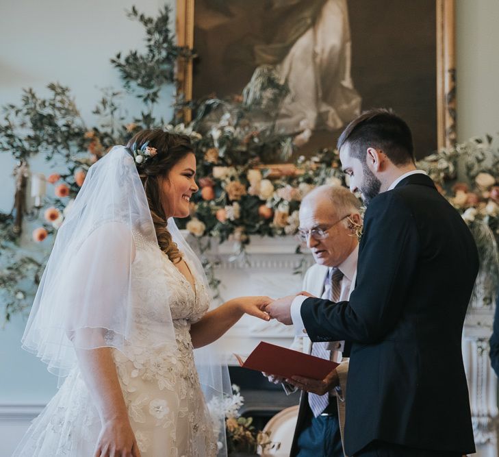 Bride and Groom Exchange Rings During Wedding Ceremony at Oxfordshire Wedding Venue