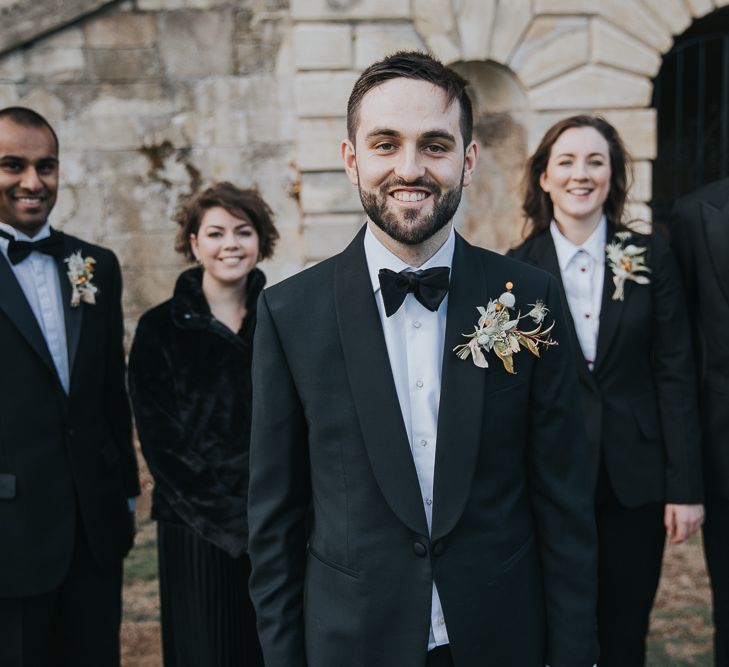 Groom and Grooms Party In Suits With Buttonholes at Kirtlington Park Wedding Venue