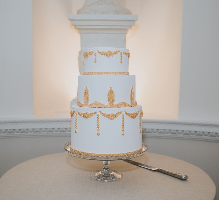 White Wedding Cake With Gold Detail