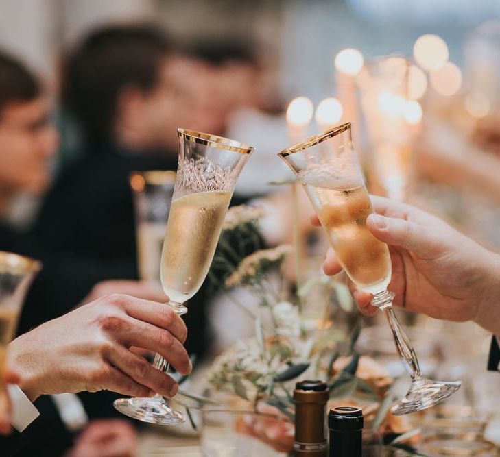 Guests Toast Bride and Groom With Champagne