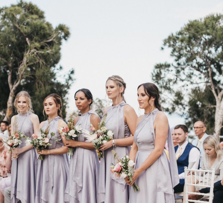 Bridesmaids in Silver Halterneck Dresses with Half Up Half Down Hemlines