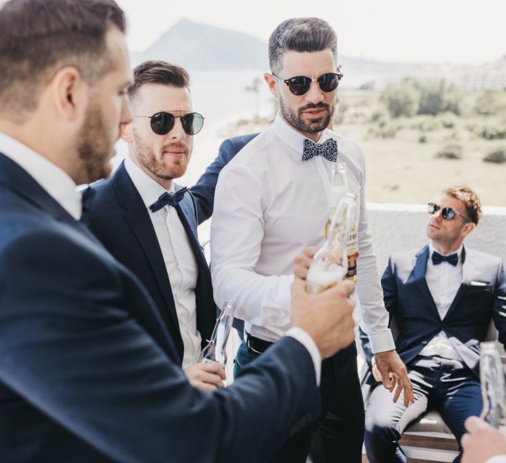 Groomsmen Sharing a Beer on the Wedding