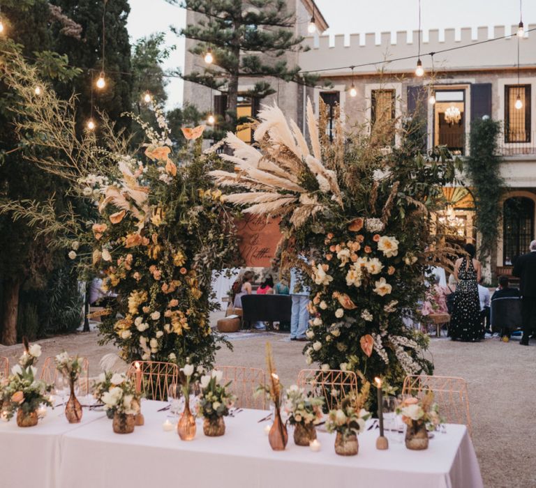 Intimate Top Table with Floral Arch Backdrop