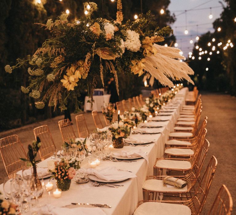 Long Wedding Reception Table with Festoon Light Canopy