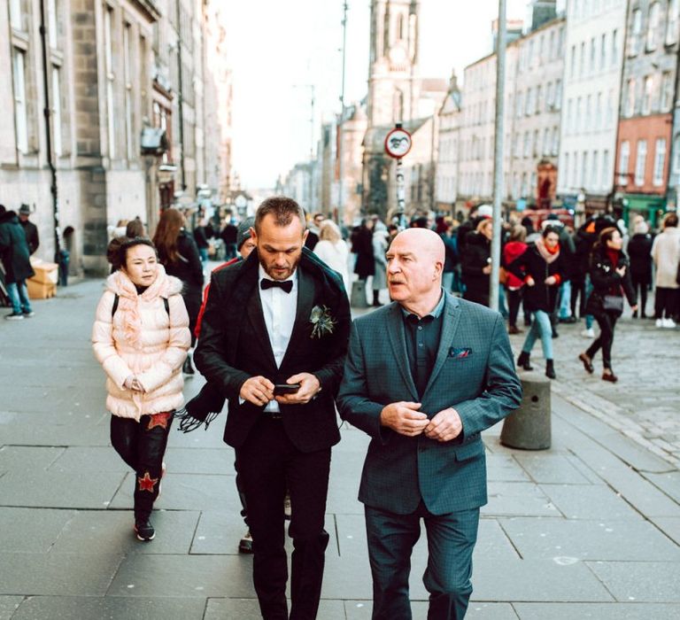 Groom and best man walking to the Edinburgh City Chambers wedding ceremony